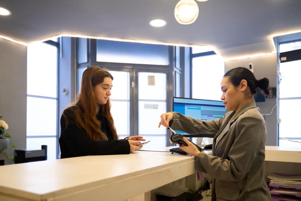 Dental patient paying for dental treatment