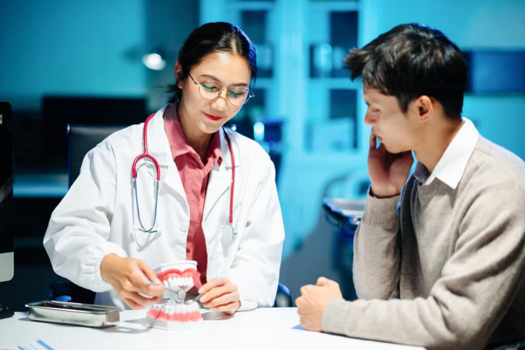 Dentist having a consultation with a new patient
