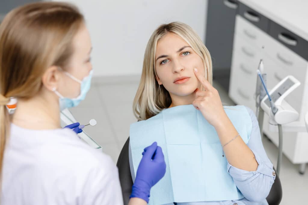 patient experiencing tooth pain