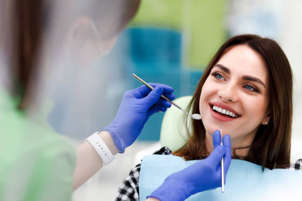 Patient getting their teeth cleaned at the dentist