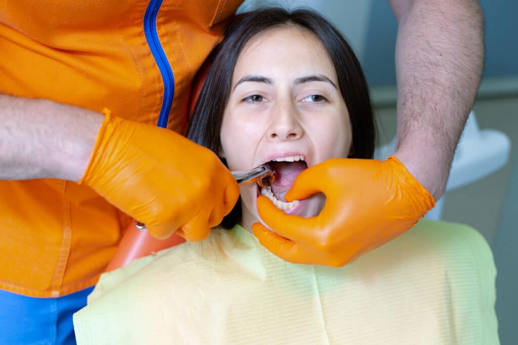 Patient undergoing a tooth extraction